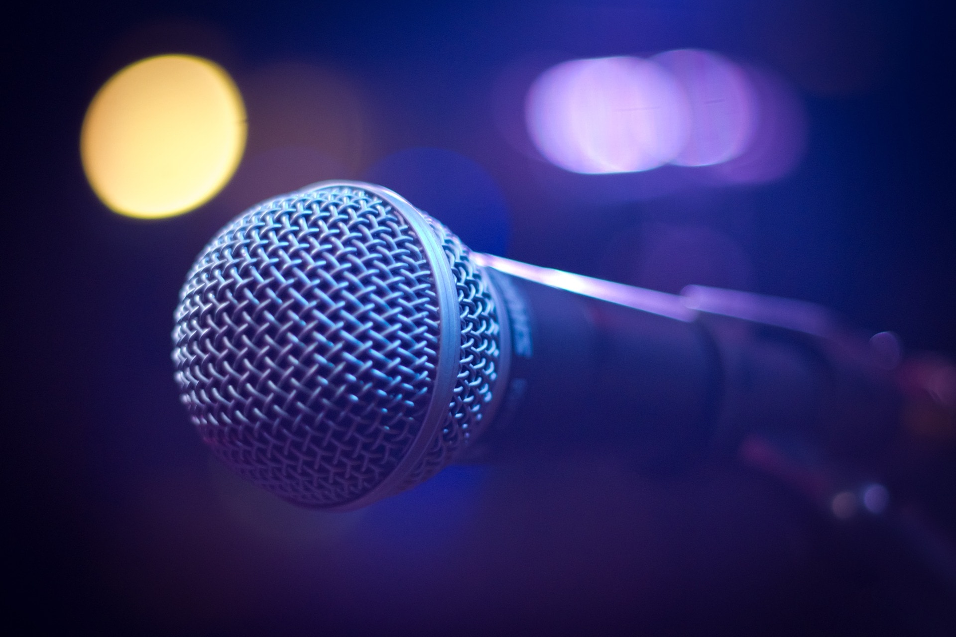 close-up of a microphone under stage lighting