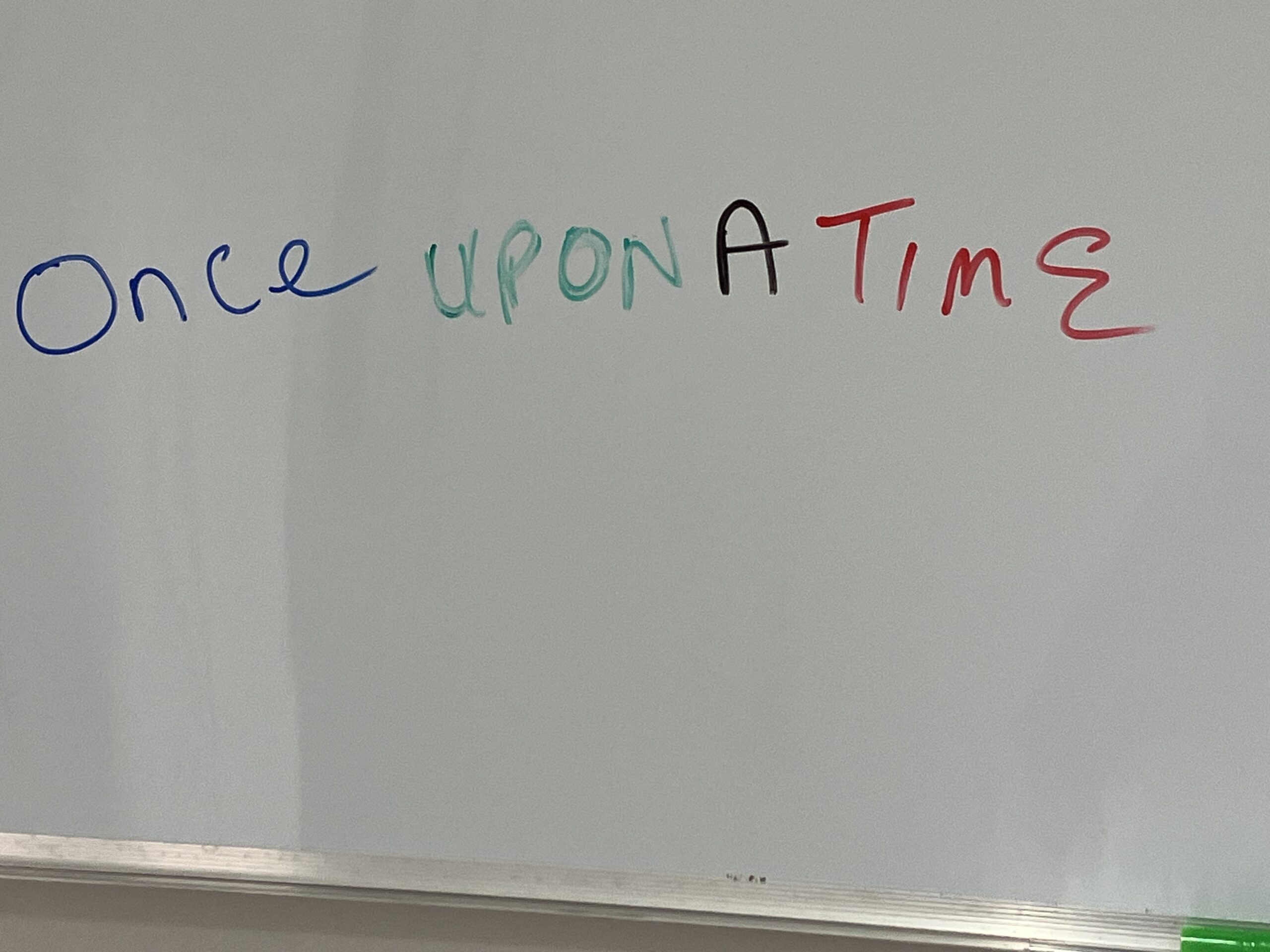 story telling whiteboard with the phrase once upon a time written across it