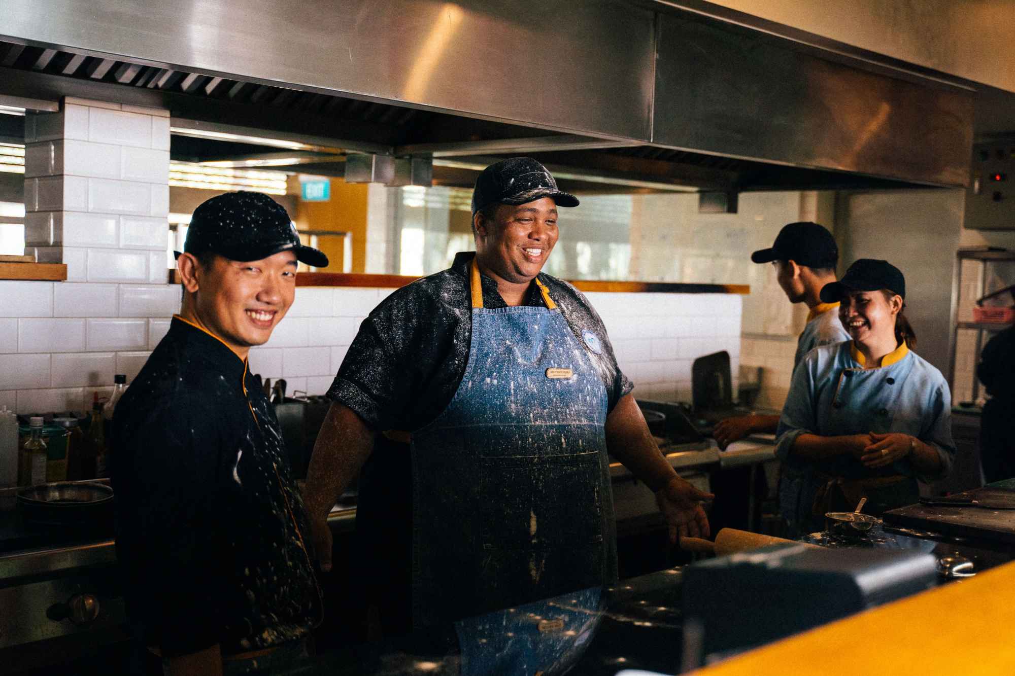fast-food restaurant staff working together in a busy commercial kitchen