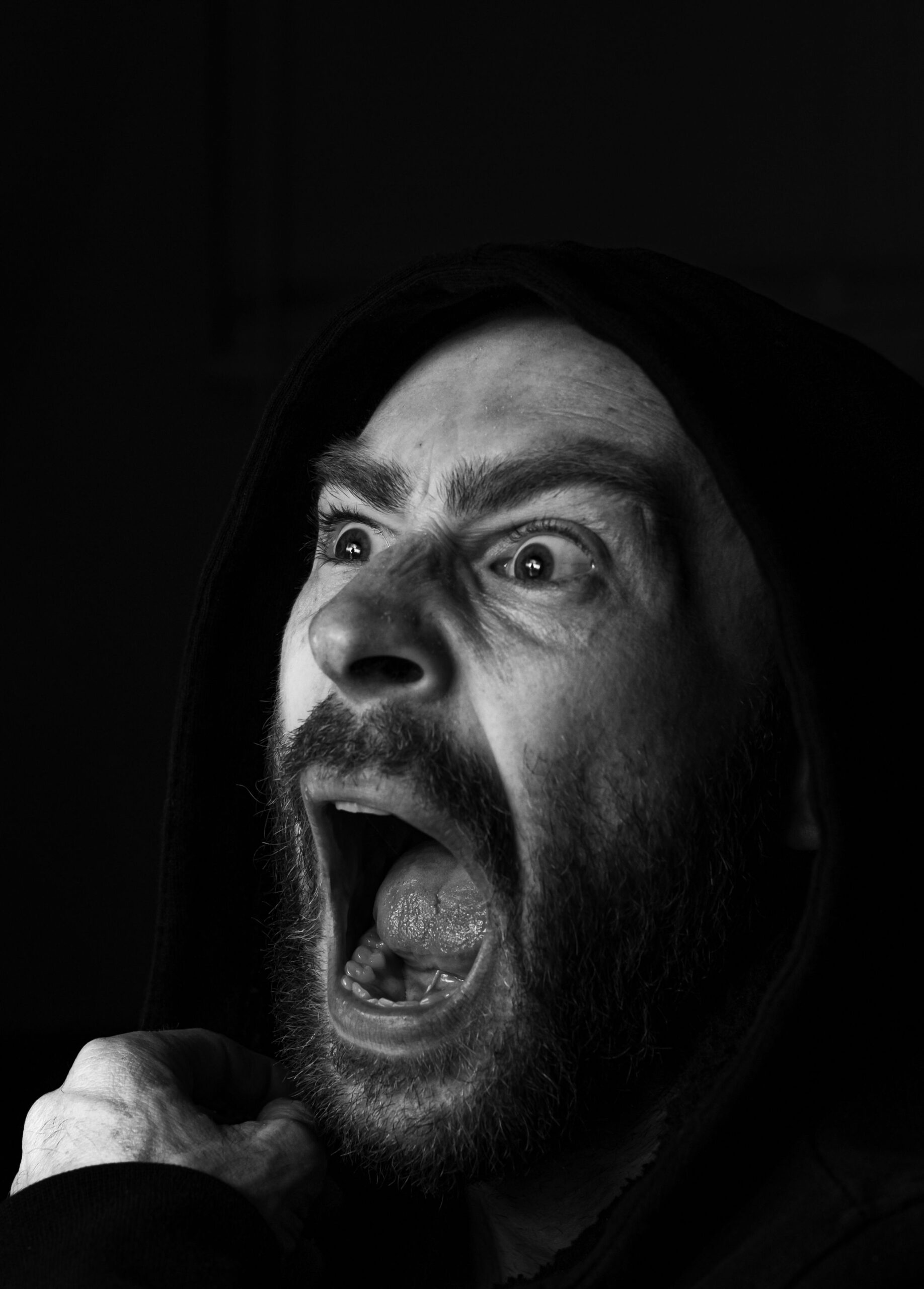 man shouting with an intense expression, illustrating fear & anxiety